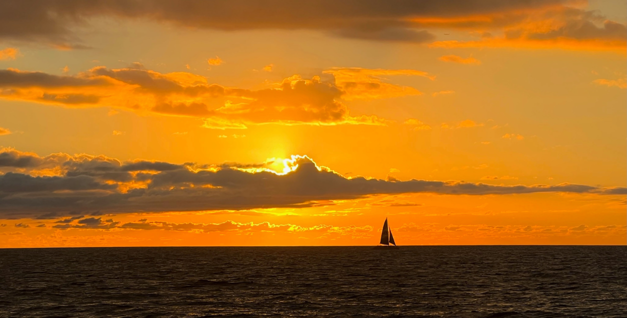 sunset from ohau with sailboat on the water