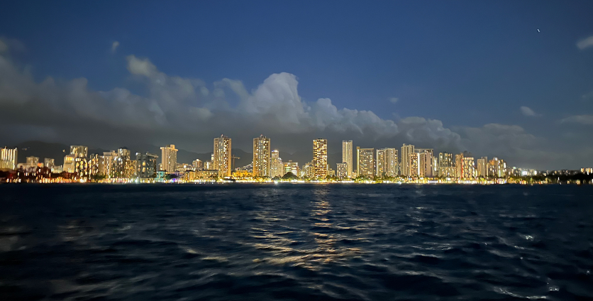 honolulu skyline during sunset fireworks cruise