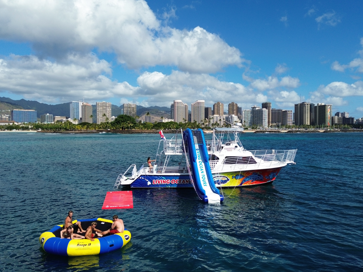double decker snorkel tour waikiki boat with waterslide, lily pad and water trampoline