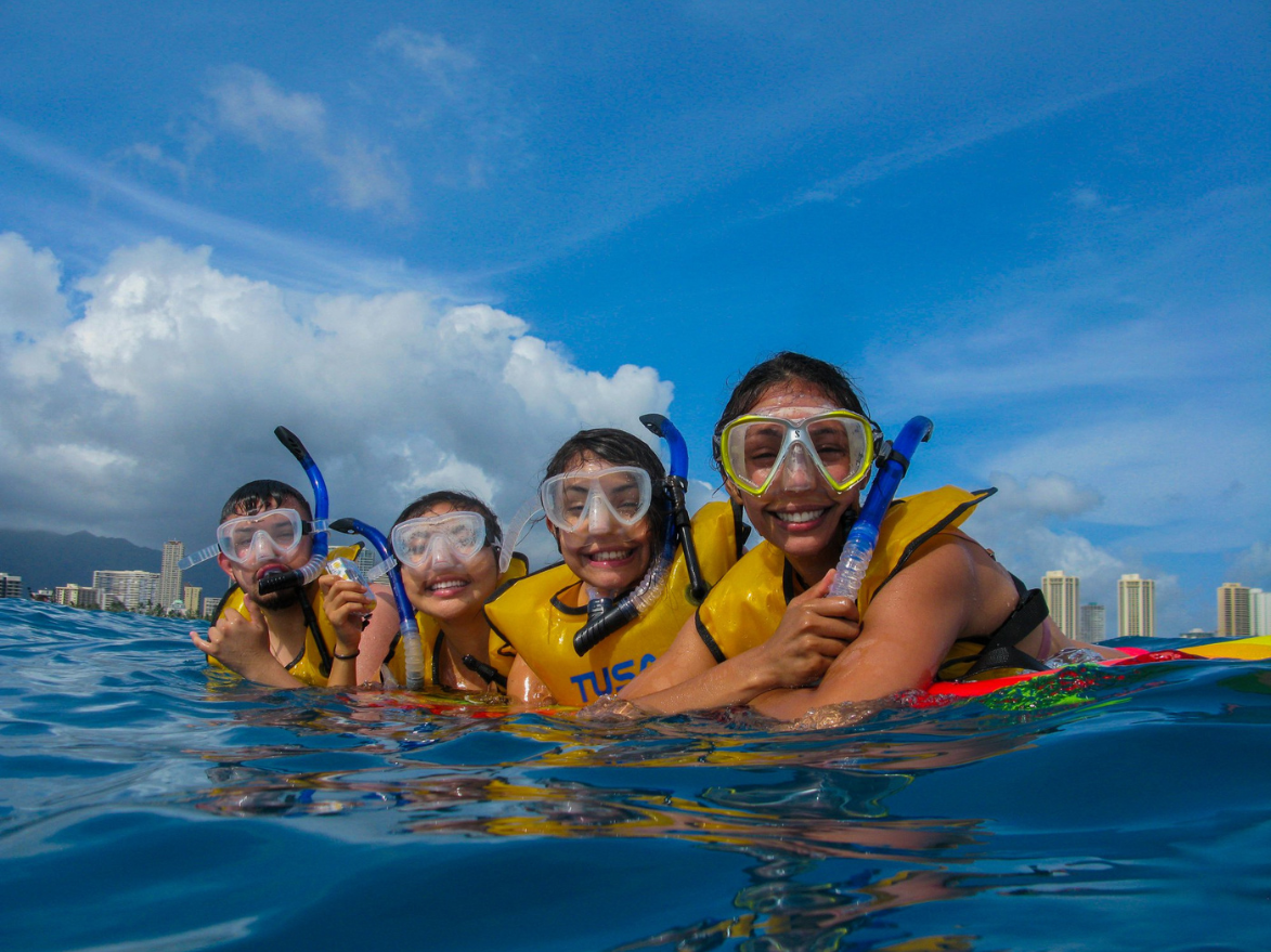 kids on waikiki snorkeling tour with living ocean tours