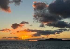 Hawaiian sunset seen during a sunset cruise in Honolulu with Living Ocean Tours