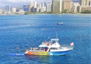 Living Ocean Tours boat with Honolulu in the background
