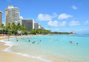 crowd of people swimming at Waikiki Beach, Honolulu